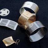 Bransolety, broszka i kolczyk - biżuteria zaprojektowana przez ewę Franczyk.