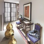 Jak zaprojektować apartament dla ludzi, którzy mieszkają z tysiącami książek, płyt, pamiątek z podróży, nie