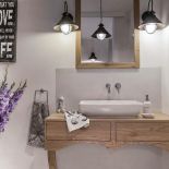 Choć w aranżacji skandynawskiej dominuje chłodna kolorystyka, odcień naturalnego drewna skutecznie ociepla wnętrze.