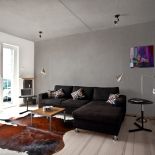 W salonie nie ma niepotrzebnych mebli - jest urządzony minimalistycznie, ale funkcjonalnie.