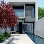 Modne połączenie: woda i szkło. Na elewacji domu kamień Campana imitujący boniowanie. STONE MASTER