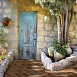 Mur z wapienia i terakotowa ścieżka w kolorze cegły. IL PALAGIO