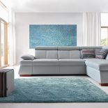 Narożnik Malpensa ma ruchome zagłówki i pojemnik na pościel, Gala Collezione.