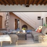 Prosto i schludnie urządzony salon - jest tu dużo światła i przestrzeni.