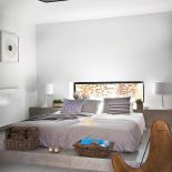 Sypialnia urządzona w szarościach, granacie i naturalnym kolorze drewna i skóry.