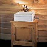 Szafka pod umywalkę Vigneron z drewna jesionowego barwionego na dąb rustykalny. W kolekcji Herbeau znajdziemy