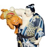 Wojownik sumo walczący z demonem. Japońskie lalki z duszą