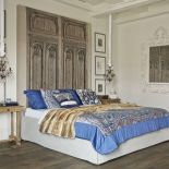 Wzorzyste poduszki i narzuty z Etro Home.