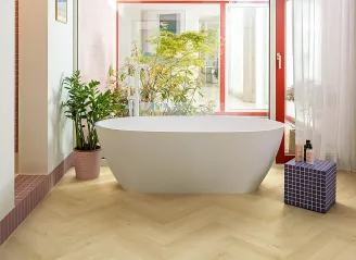 Quick-Step wprowadza na rynek pierwszą na świecie wodoodporną cichą w użytkowaniu jodełkę laminowaną