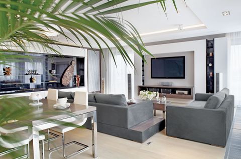 Meble zrobione są na zamówienie - z białego albo czarnego MDF-u lub zimnego czekoladowego forniru.