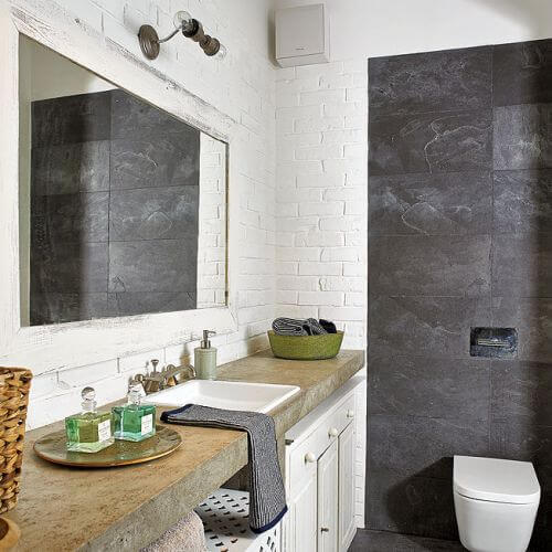 Dominuje kolor szarego surowego betonu i bieli. Dodatki w ciepłym kolorze wikliny.