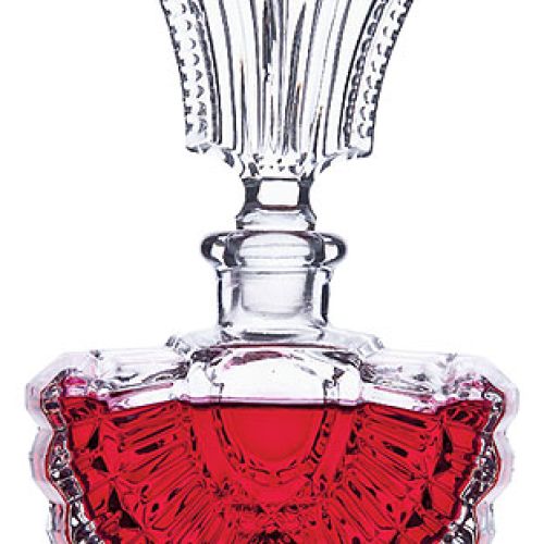 Kryształowy flakon z dekoracyjnym korkiem.