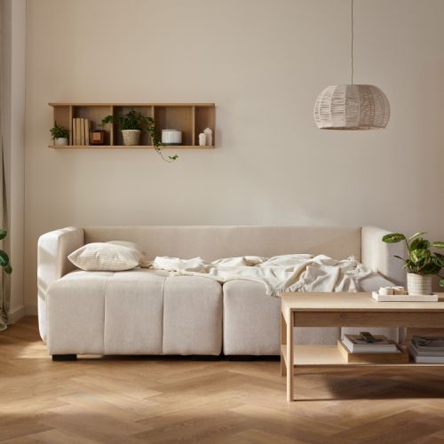 wielofunkcyjna sofa łącząca funkcję narożnika z podwójnym szezlongiem oraz praktycznym miejscem do przechowywania