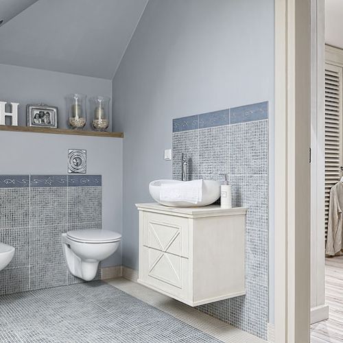 Pomysł na dom zrodził się podczas wakacji nad morzem. Jest spokojny, w kolorach piasku, z