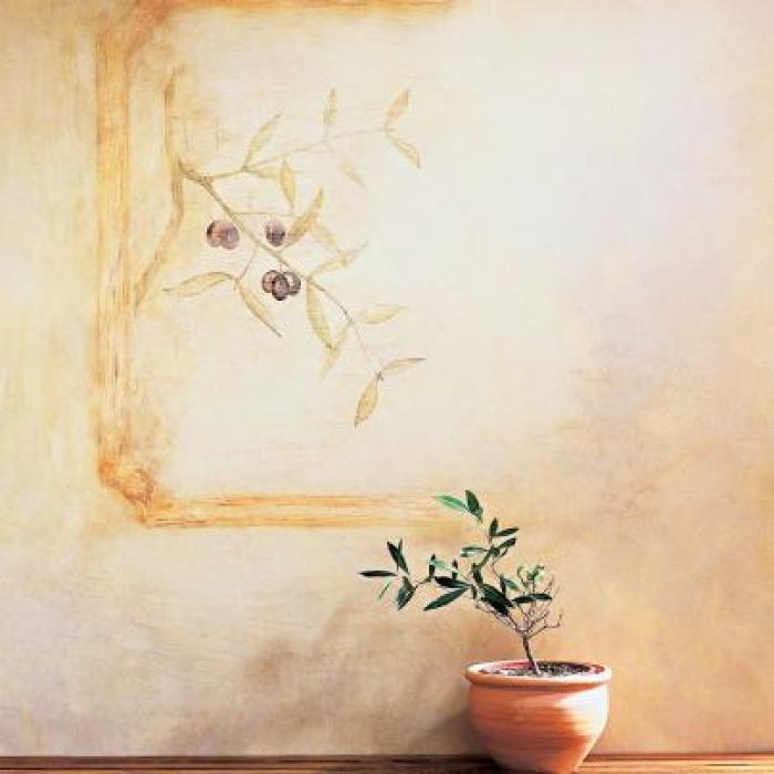 Fresk przedstawiający gałązkę oliwną zdobi ścianę.