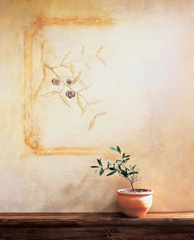 Fresk przedstawiający gałązkę oliwną zdobi ścianę.