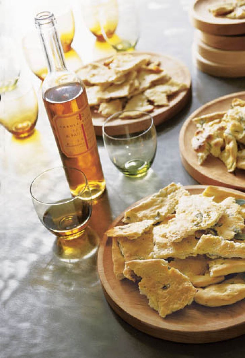 Podpieczone chlebki pita, do tego kilka smaczych dipów, butelka wina - i przyjęcie w ogrodzie gotowe.