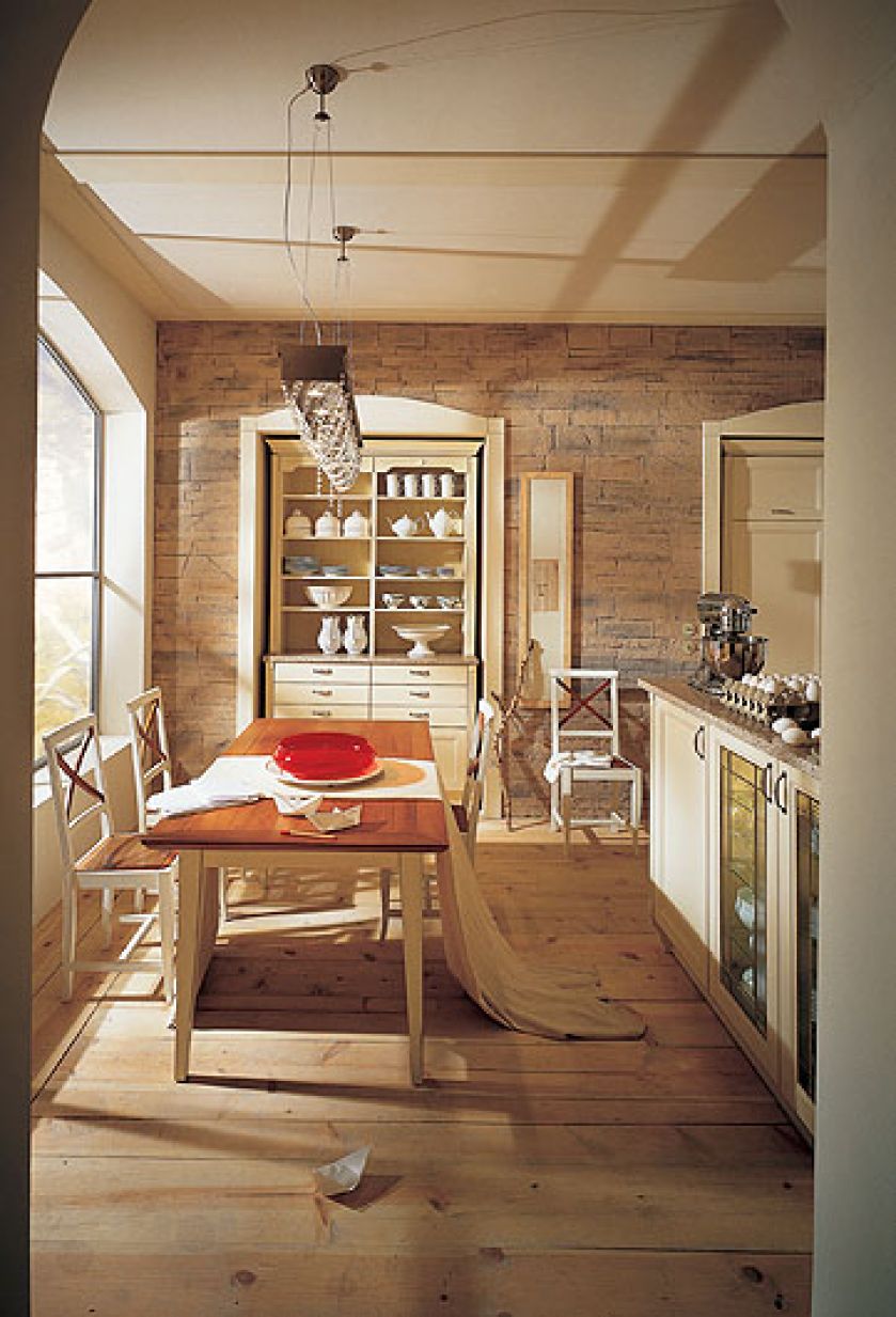 Kuchnia urządzona z kredensem ustawionym we wnęce. ALNO