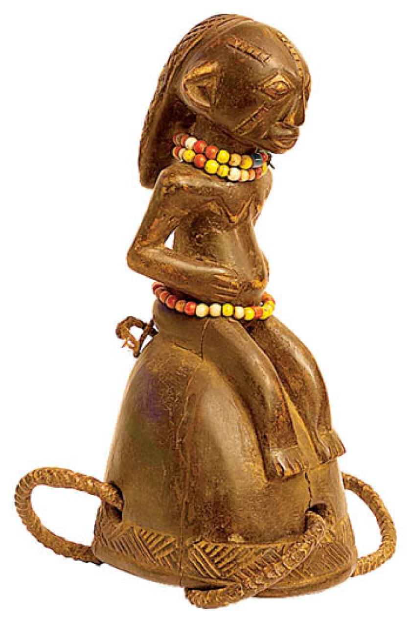 Drewniany rytualny dzwonek z Kongo. Z plecionym ozdobami z rafii. Dzwonek z kolekcji Lecha Pileckiego