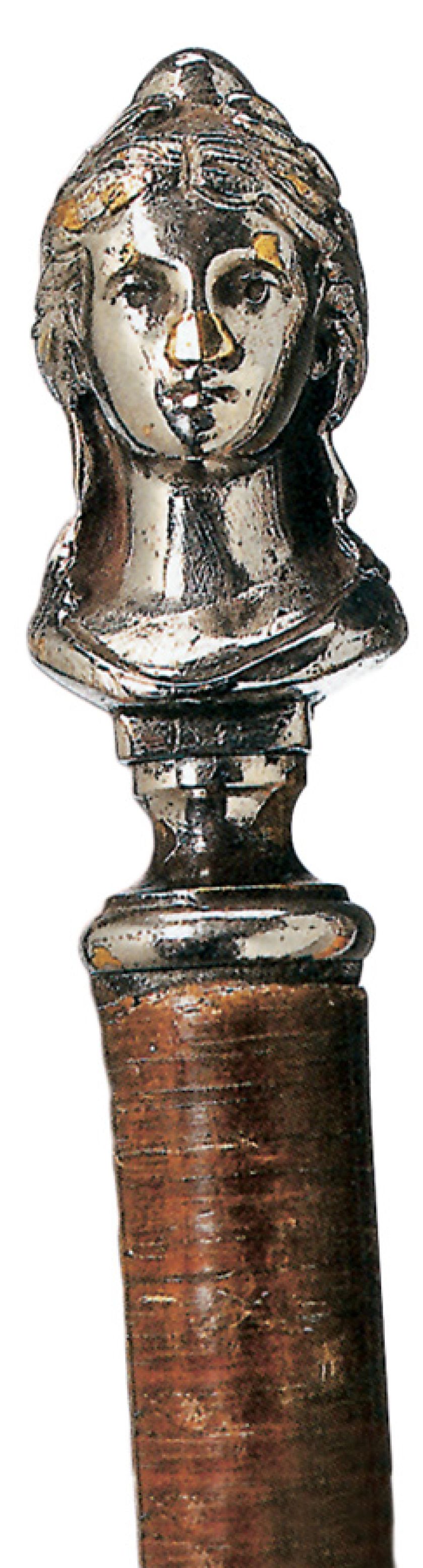 Z gałką – damską głową. Magiczny kijek