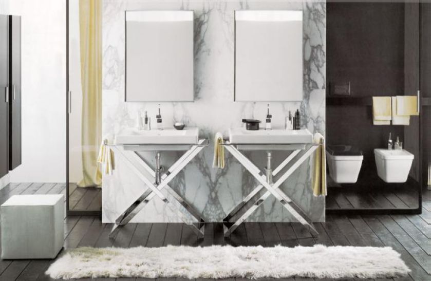 Kolekcja inspirowana stylem art déco. Chromowany stojak na umywalkę ma szerokość 81 cm i głębokość 53 cm. KOŁO