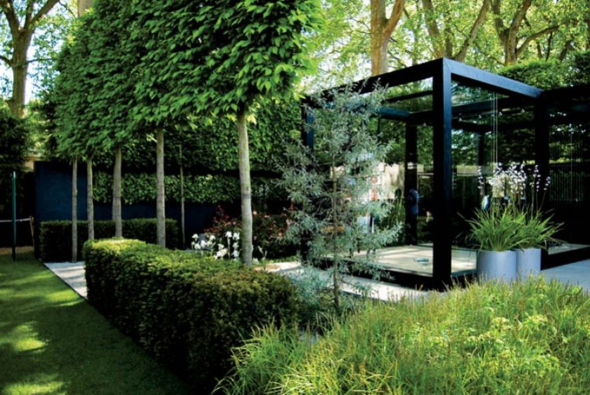 Nowoczesny kubik wśród zielonych ścian. ARCHIKRAJOBRAZ