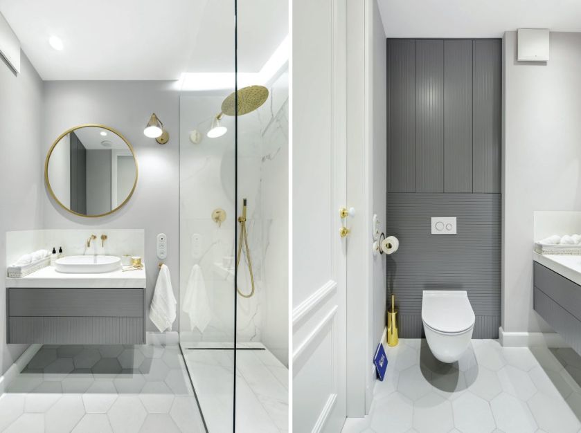 Obszerną kabinę prysznicową wyłożono płytkami gresowymi Infiniti przypominającymi marmur. Dla kontrastu dobrano złotą